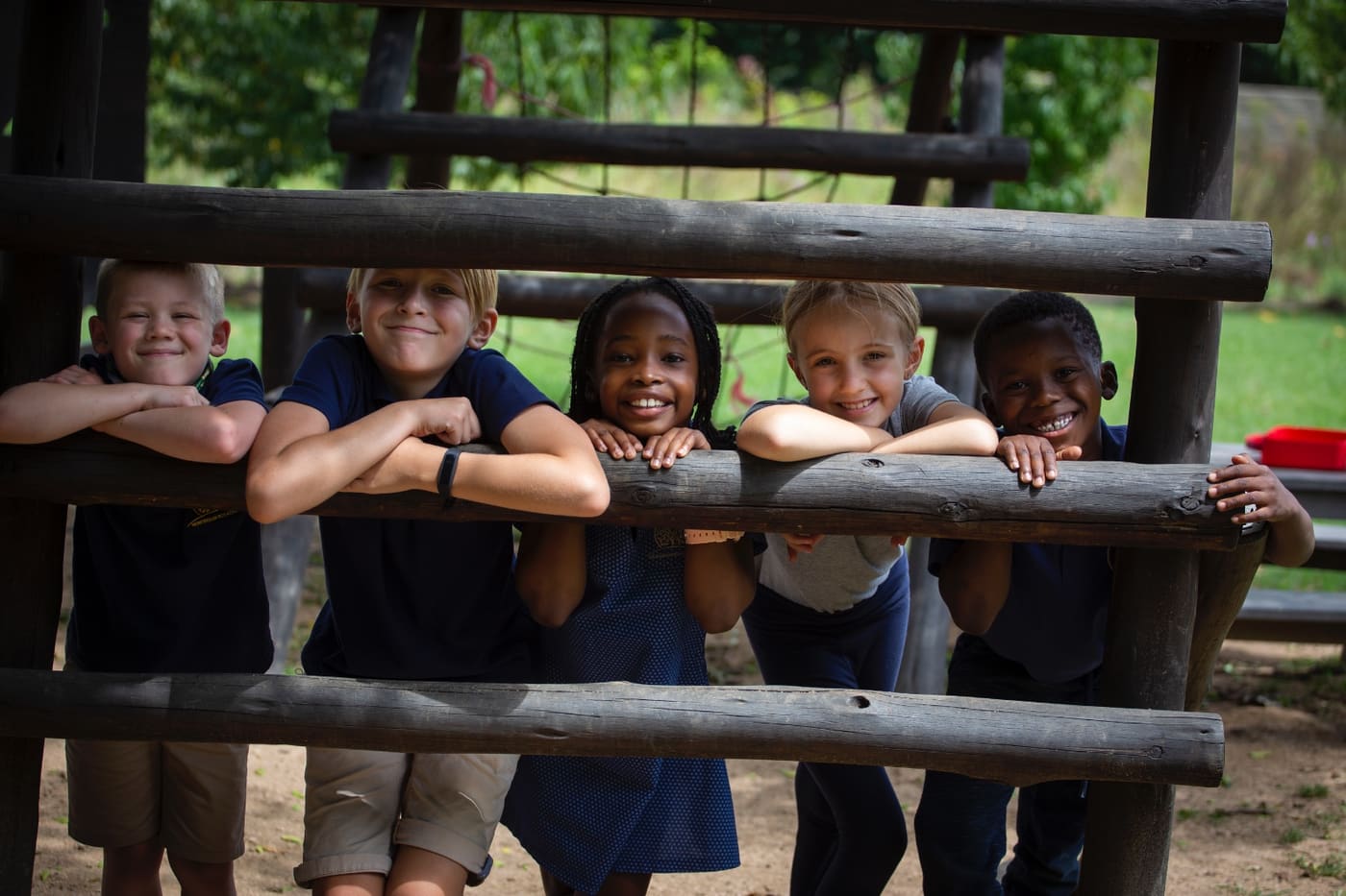 Children exploring the Montessori Eco Schools grounds
